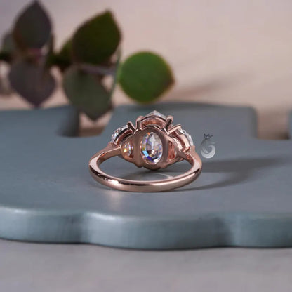Antique Old Mine Oval Moissanite Three-Stone Ring, Half Moon Side Stones